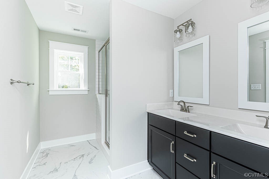 8473 Lincoln Road Mechanicsville, VA 23116 - Photo 23 of 46 a bathroom with a sink a mirror and next to a window