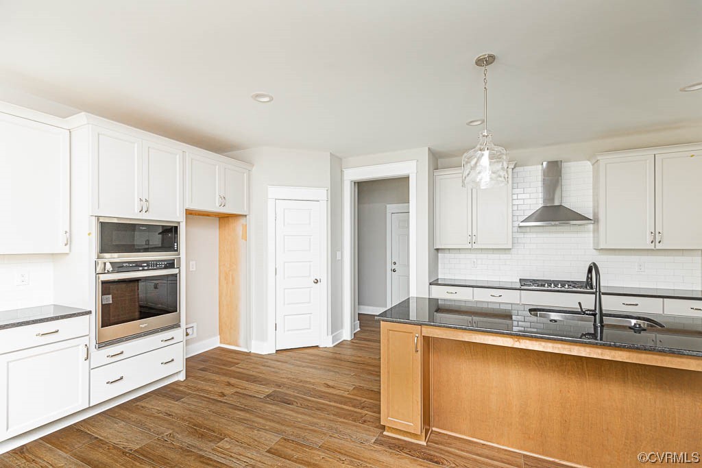 8473 Lincoln Road Mechanicsville, VA 23116 - Photo 8 of 46 a kitchen with stainless steel appliances granite countertop a sink a stove and a refrigerator