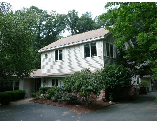 21 Judith Road Chelmsford, MA 01824 - Photo 4 of 17 a house that has a tree in front of it