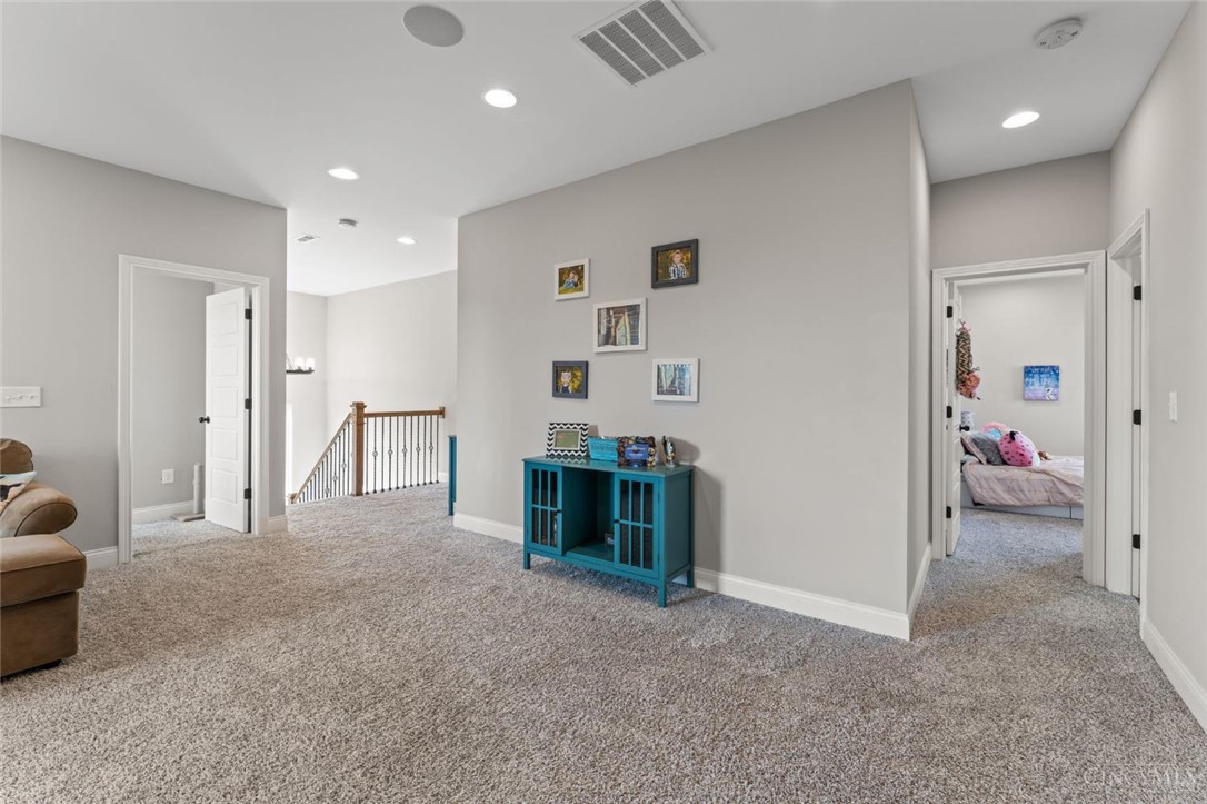 2425 Middleboro Road Clarksville, OH 45113 - Photo 60 of 91 This bright hallway connects to various rooms, offering a clear view of the stairway.