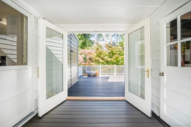 a view of a room with wooden floor and windows