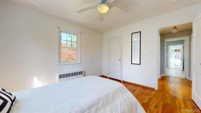 a bedroom with bed and window