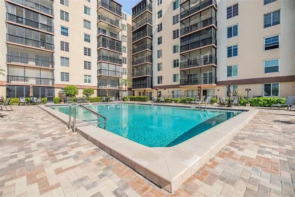 a view of pool with outdoor seating