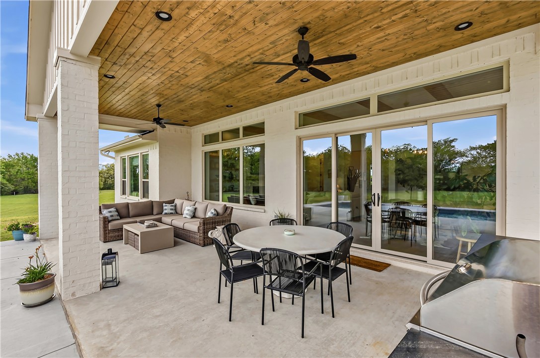 10701 Harvey Ranch Road College Station, TX 77845 - Photo 40 of 48 a outdoor space with patio the couches and dining table with garden view