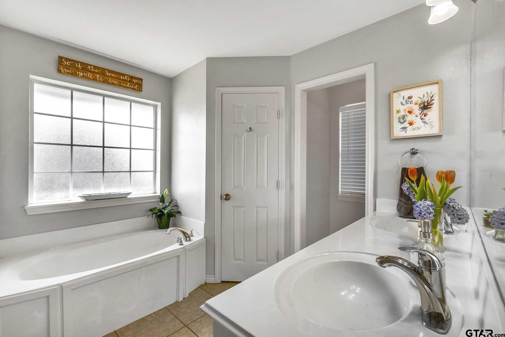 101 Collin Drive Chandler, TX 75758 - Photo 13 of 24 a bath room with a sink and a bathtub