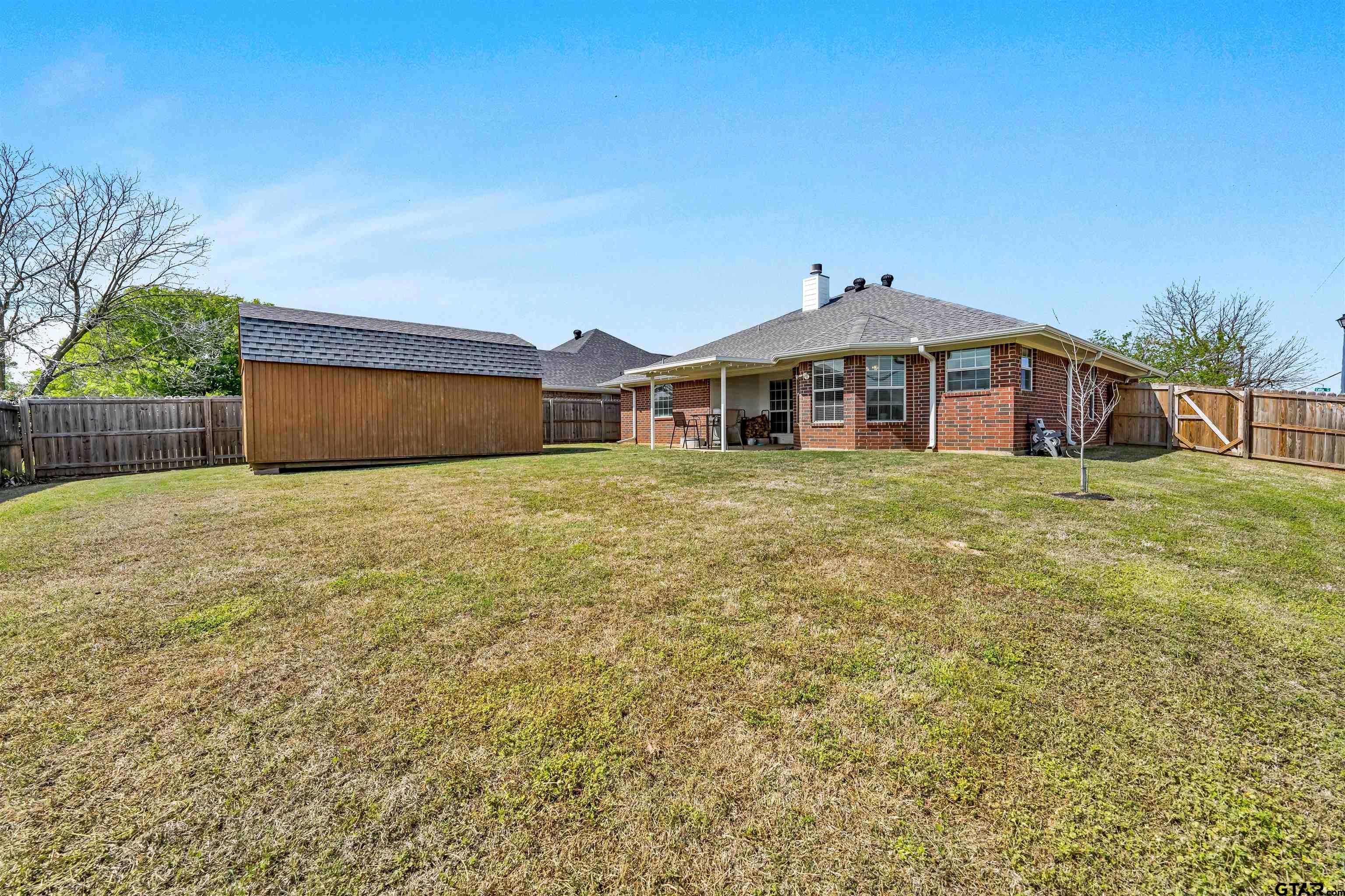 101 Collin Drive Chandler, TX 75758 - Photo 22 of 24 a view of a house with a yard and potted plants