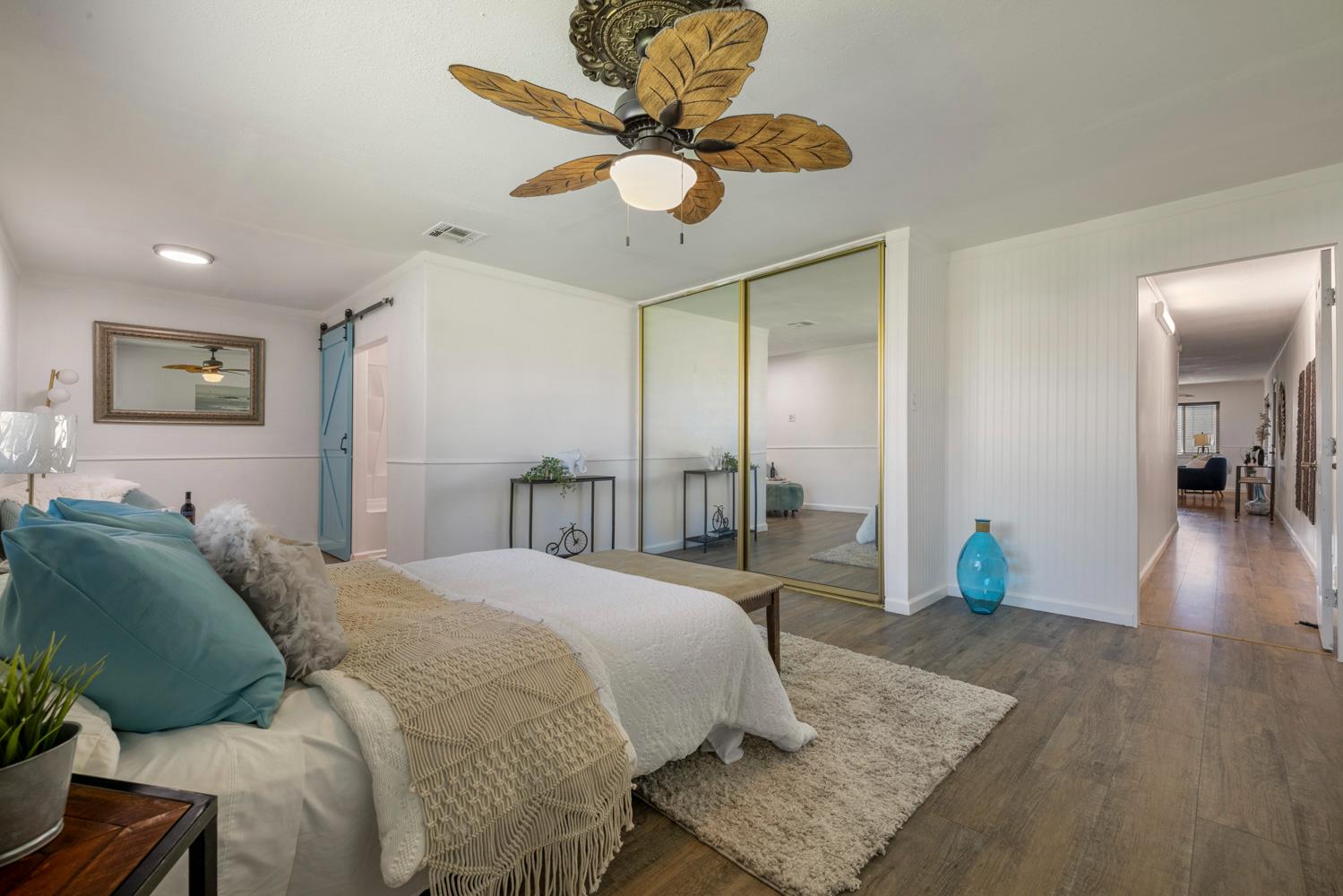 2621 Prescott Road, Unit 79 Modesto, CA 95350 - Photo 35 of 41 a bedroom with a bed and painting on the wall