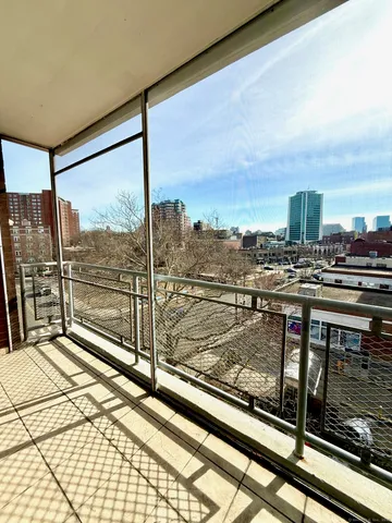 a view of a balcony with city view