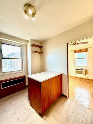 a kitchen with stainless steel appliances granite countertop a sink and a stove