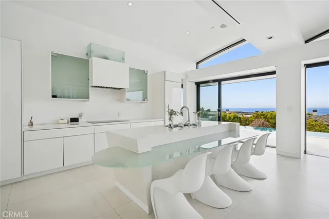 a kitchen with stainless steel appliances a sink and a refrigerator