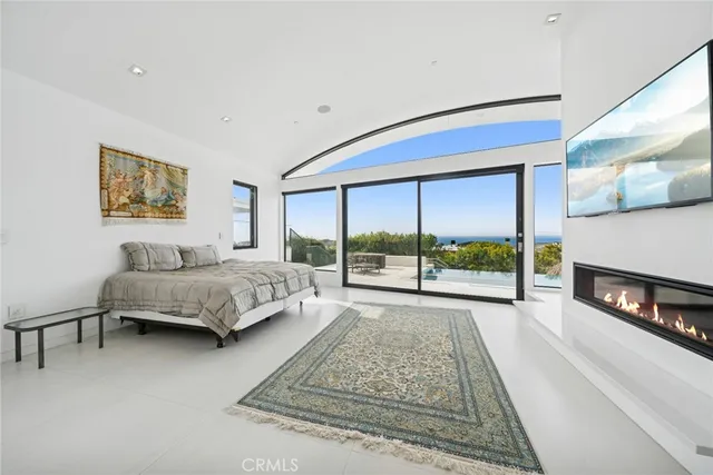a living room with furniture and next to a window