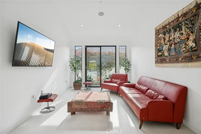 a room with pool table and windows