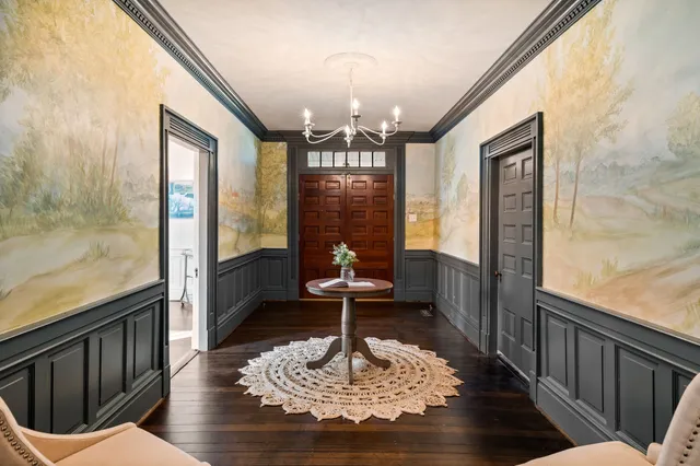 a view of a swimming pool with an outdoor seating and a yard