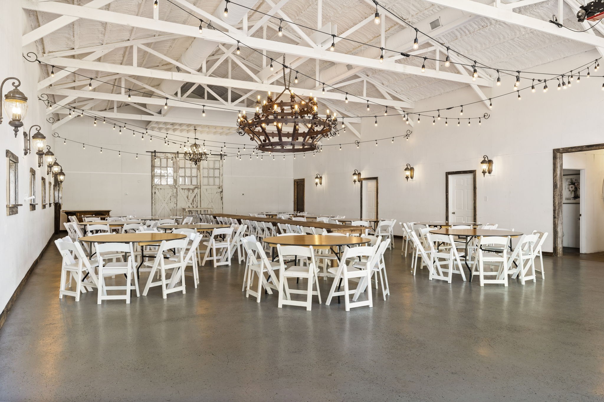 2133 Allisona Road Eagleville, TN 37060 - Photo 49 of 100 a dining room with wooden floor a chandelier a glass table and chairs