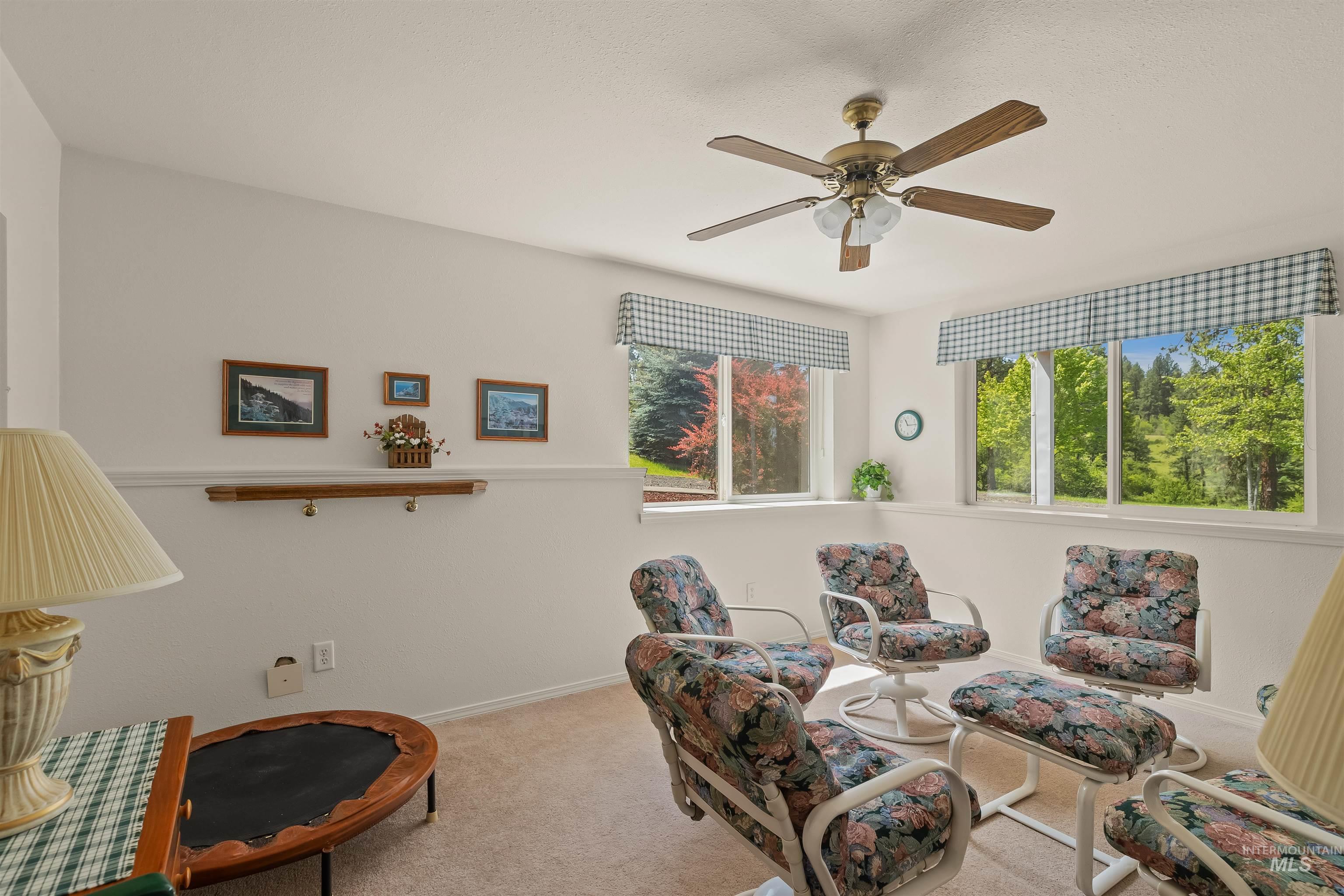 743 Wall Crk Road Stites, ID 83552 - Photo 34 of 48 Bright room with multiple windows showcasing exterior greenery