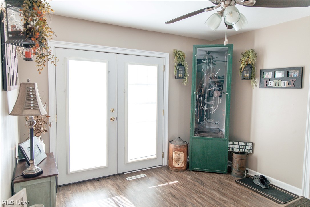 4750 Turney Road Madison, OH 44057 - Photo 12 of 42 Entryway featuring french doors, ceiling fan, and a wealth of natural light