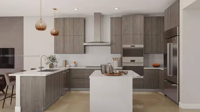 a kitchen with a sink a microwave a stove and refrigerator