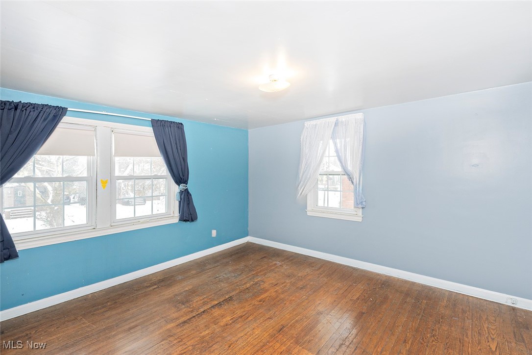 3719 Berkeley Road Cleveland Heights, OH 44118 - Photo 16 of 44 Empty room with wood-type flooring and baseboards