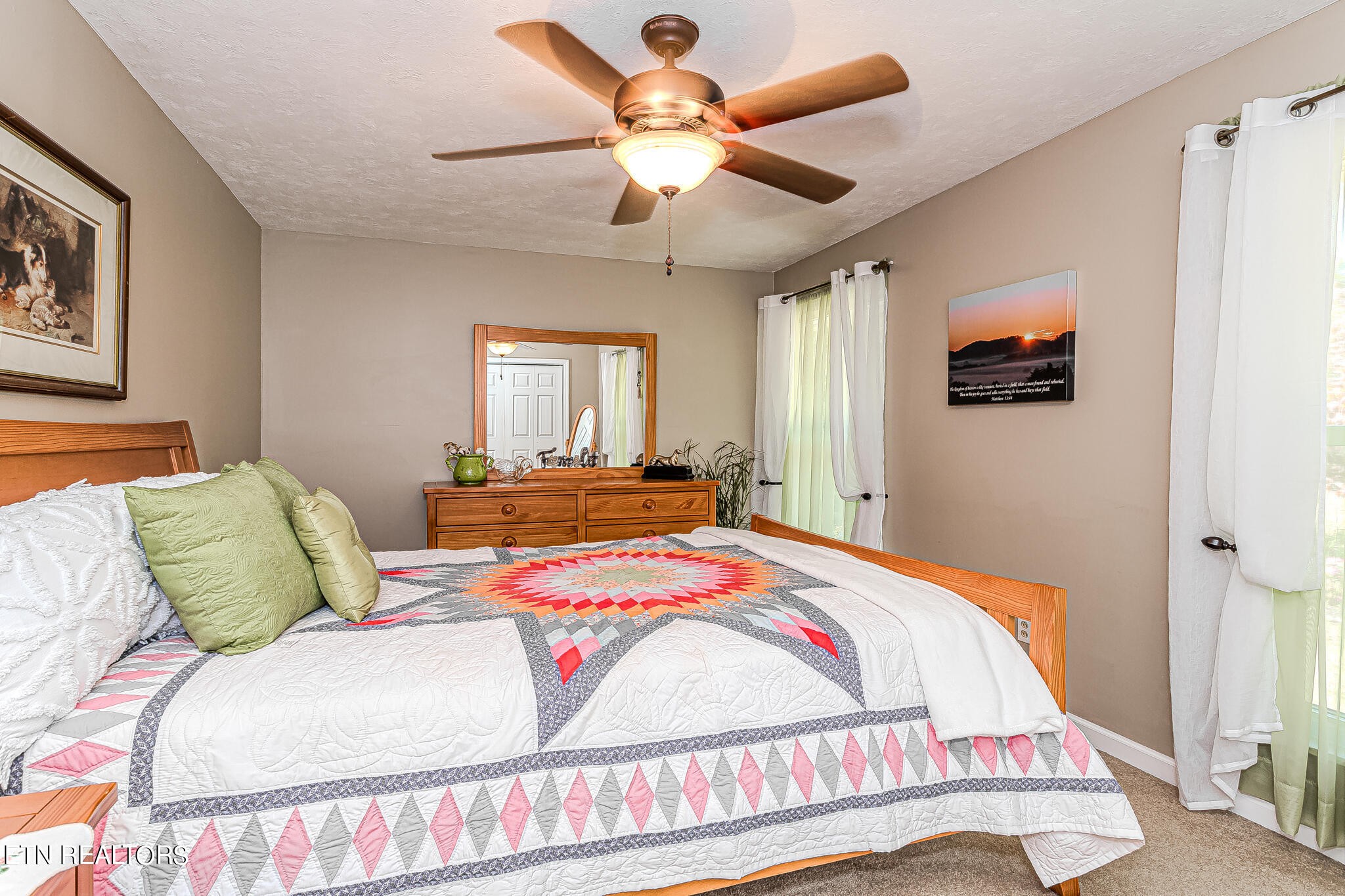 6011 Renee Road Corryton, TN 37721 - Photo 21 of 56 a bedroom with a bed and a chandelier
