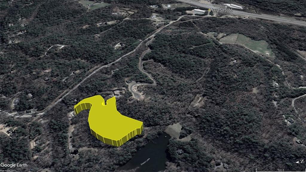 220 Maxwell Mountain Road Blue Ridge, GA 30513 - Photo 10 of 11 a view of a swimming pool in he middle of the green field