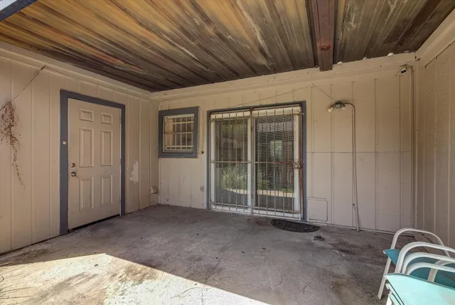a view of a room with wooden walls