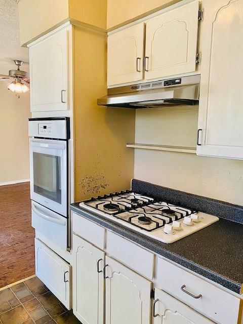 6009 Deborah Lane Watauga, TX 76148 - Photo 12 of 13 a kitchen with granite countertop a sink cabinets and appliances
