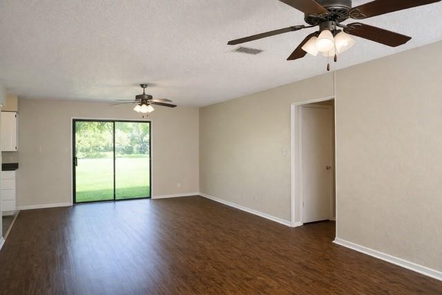 6009 Deborah Lane Watauga, TX 76148 - Photo 3 of 13 a view of empty room with wooden floor and fan