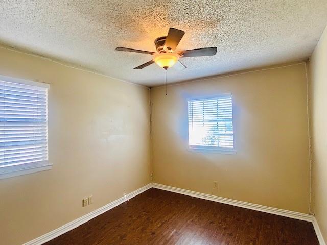 6009 Deborah Lane Watauga, TX 76148 - Photo 6 of 13 a view of an empty room with a window and wooden floor