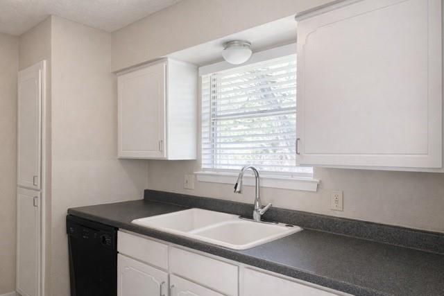 6009 Deborah Lane Watauga, TX 76148 - Photo 10 of 13 a kitchen with a sink and cabinets
