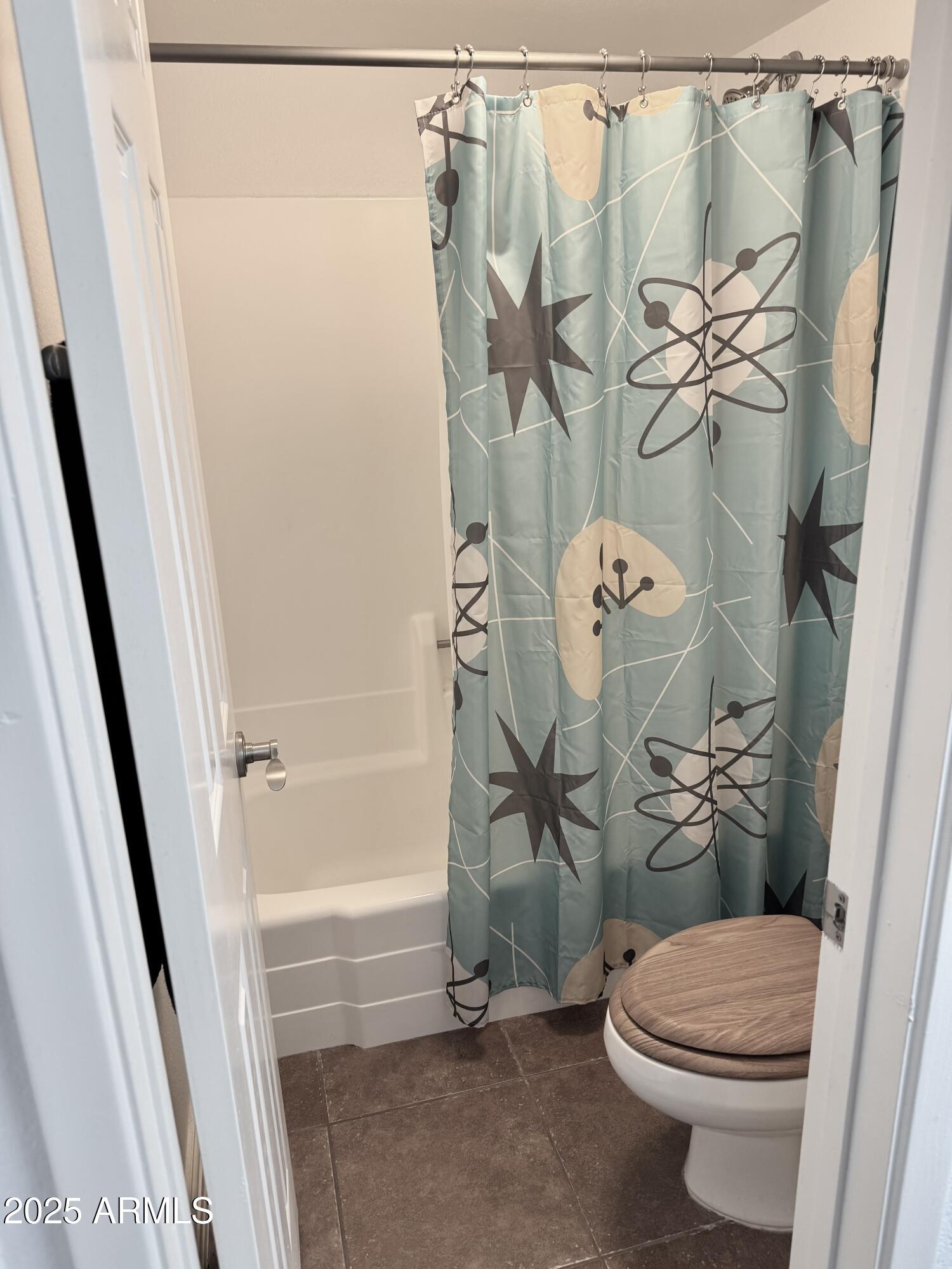 3825 East Camelback Road, Unit 152 Phoenix, AZ 85018 - Photo 12 of 28 a bathroom with a sink a toilet and a shower curtain