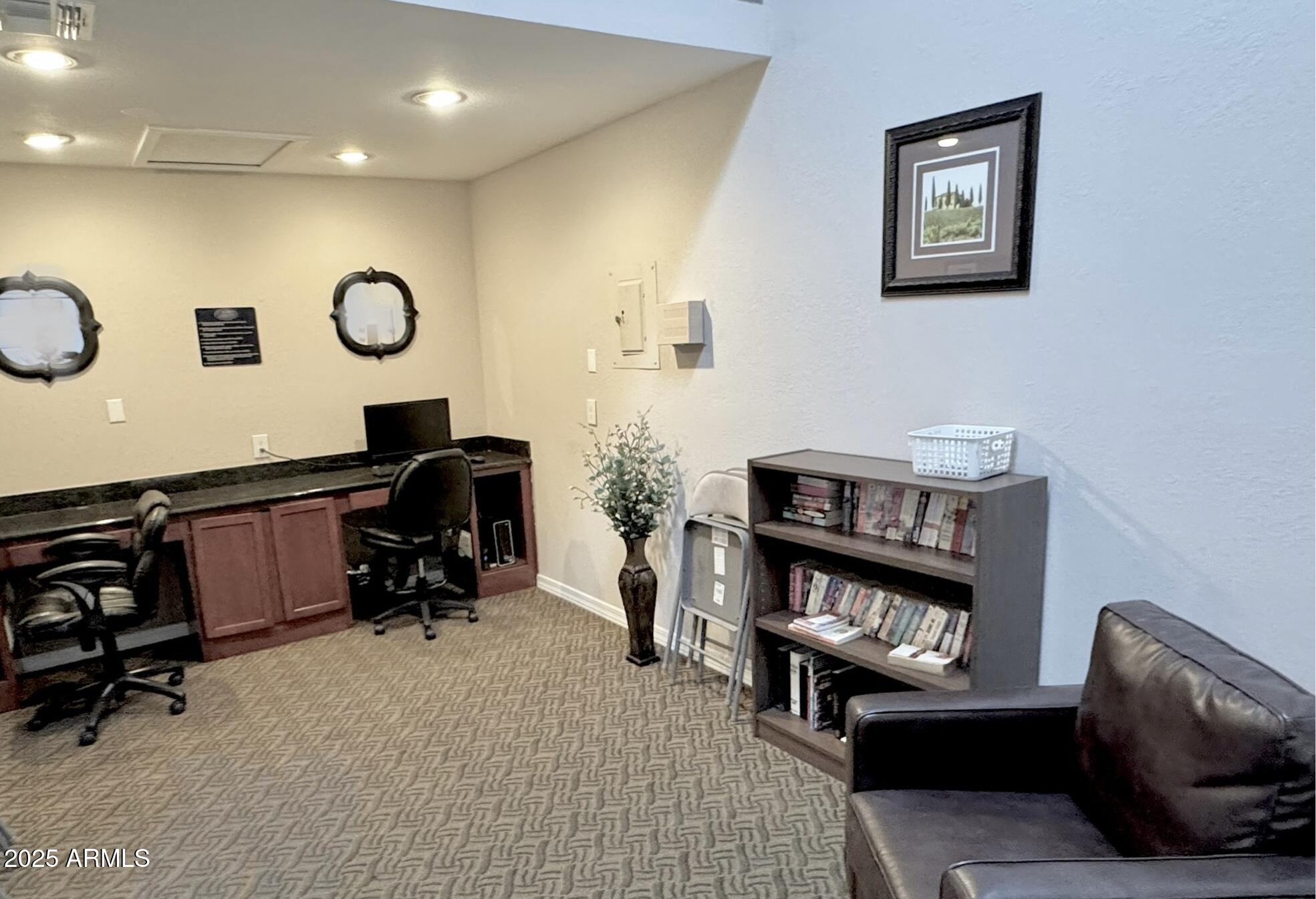 3825 East Camelback Road, Unit 152 Phoenix, AZ 85018 - Photo 19 of 28 a view of a livingroom with workspace and a couch