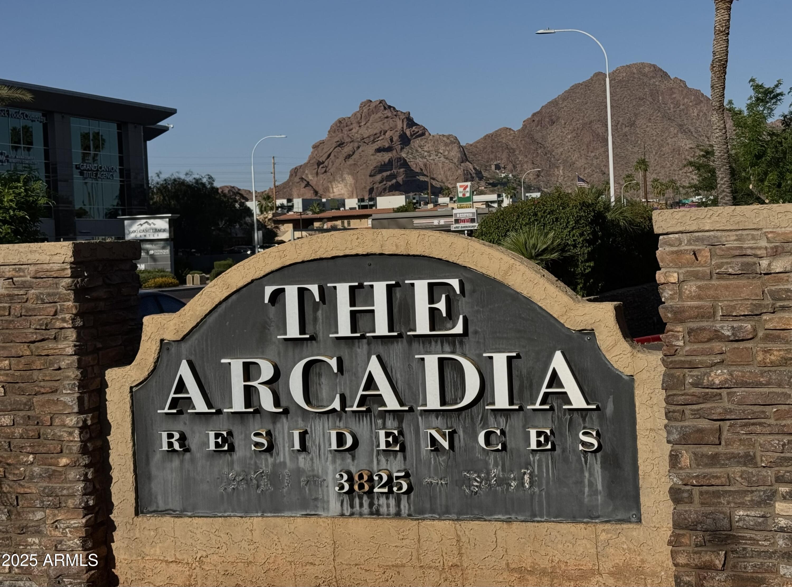 3825 East Camelback Road, Unit 152 Phoenix, AZ 85018 - Photo 25 of 28 a front view of a house with a yard