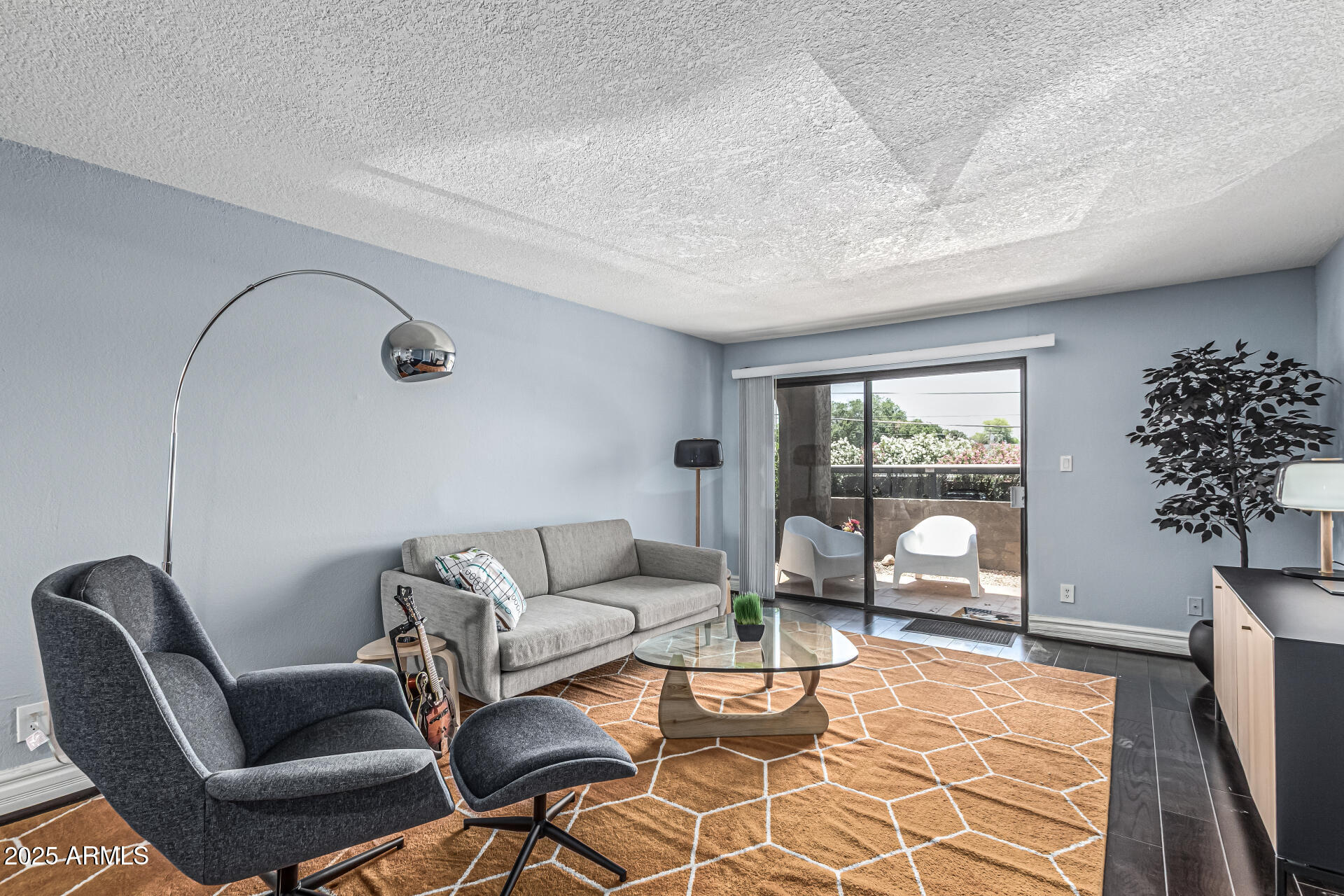 3825 East Camelback Road, Unit 152 Phoenix, AZ 85018 - Photo 3 of 28 a living room with furniture potted plant and a large window