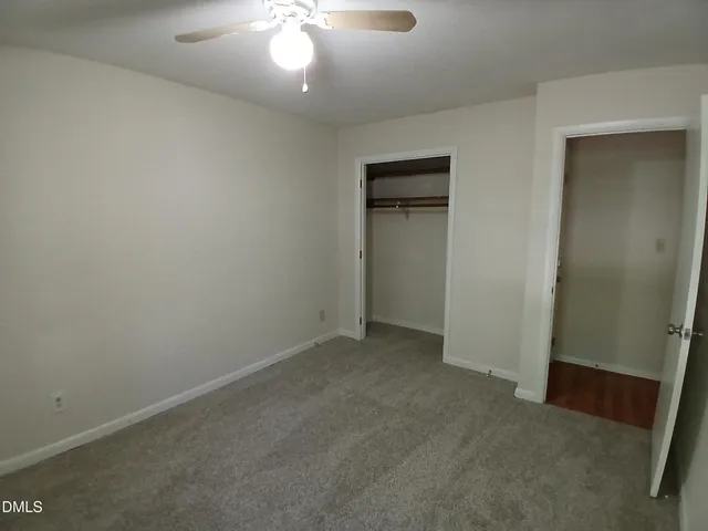 an empty room with a bathroom