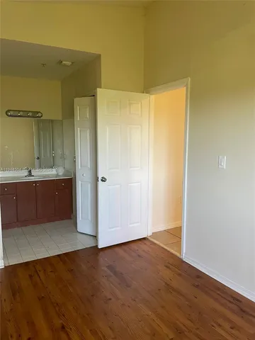 a view of a bathroom with a shower and a sink