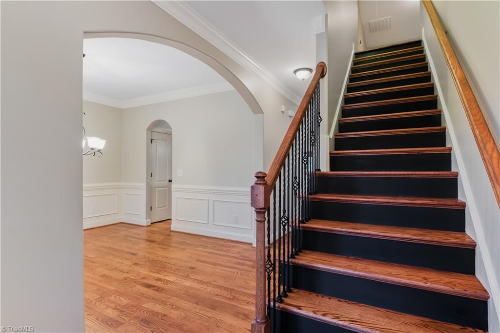 1910 Curraghmore Road Clemmons, NC 27012 - Photo 3 of 37 What an entry! Arched doorway leads to the formal dining area