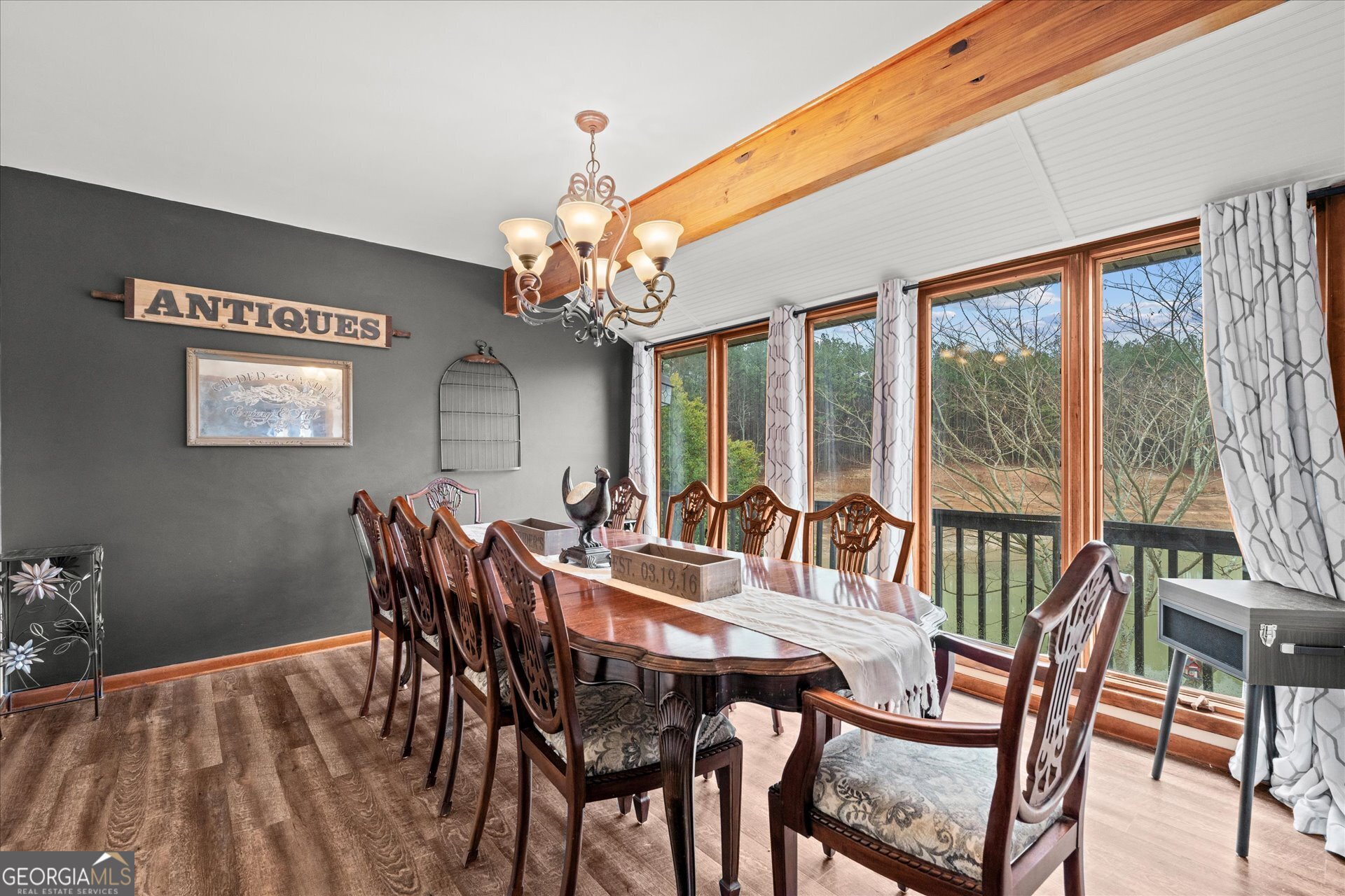 620 Smyrna Church Road Carrollton, GA 30117 - Photo 14 of 68 a view of a dining room with furniture a chandelier and large windows