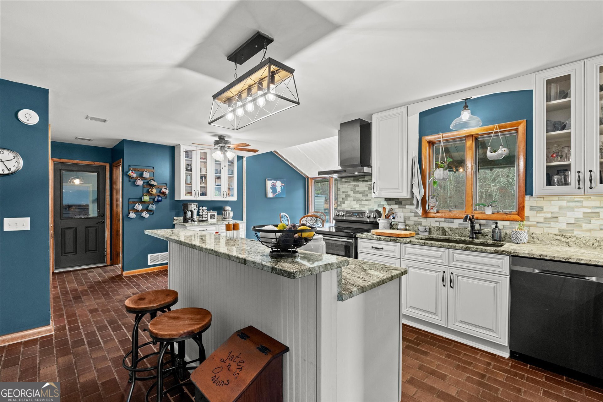 620 Smyrna Church Road Carrollton, GA 30117 - Photo 16 of 68 a kitchen with stainless steel appliances a sink and cabinets