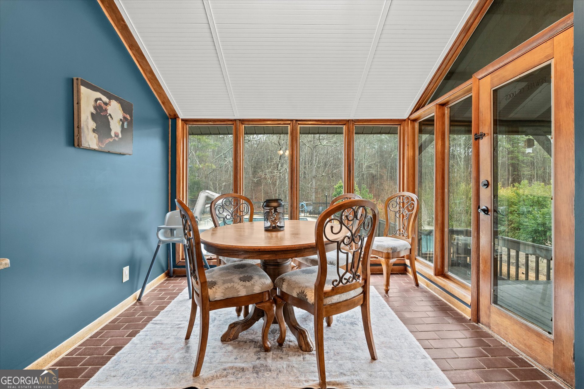 620 Smyrna Church Road Carrollton, GA 30117 - Photo 20 of 68 a dining room with furniture a chandelier and wooden floor
