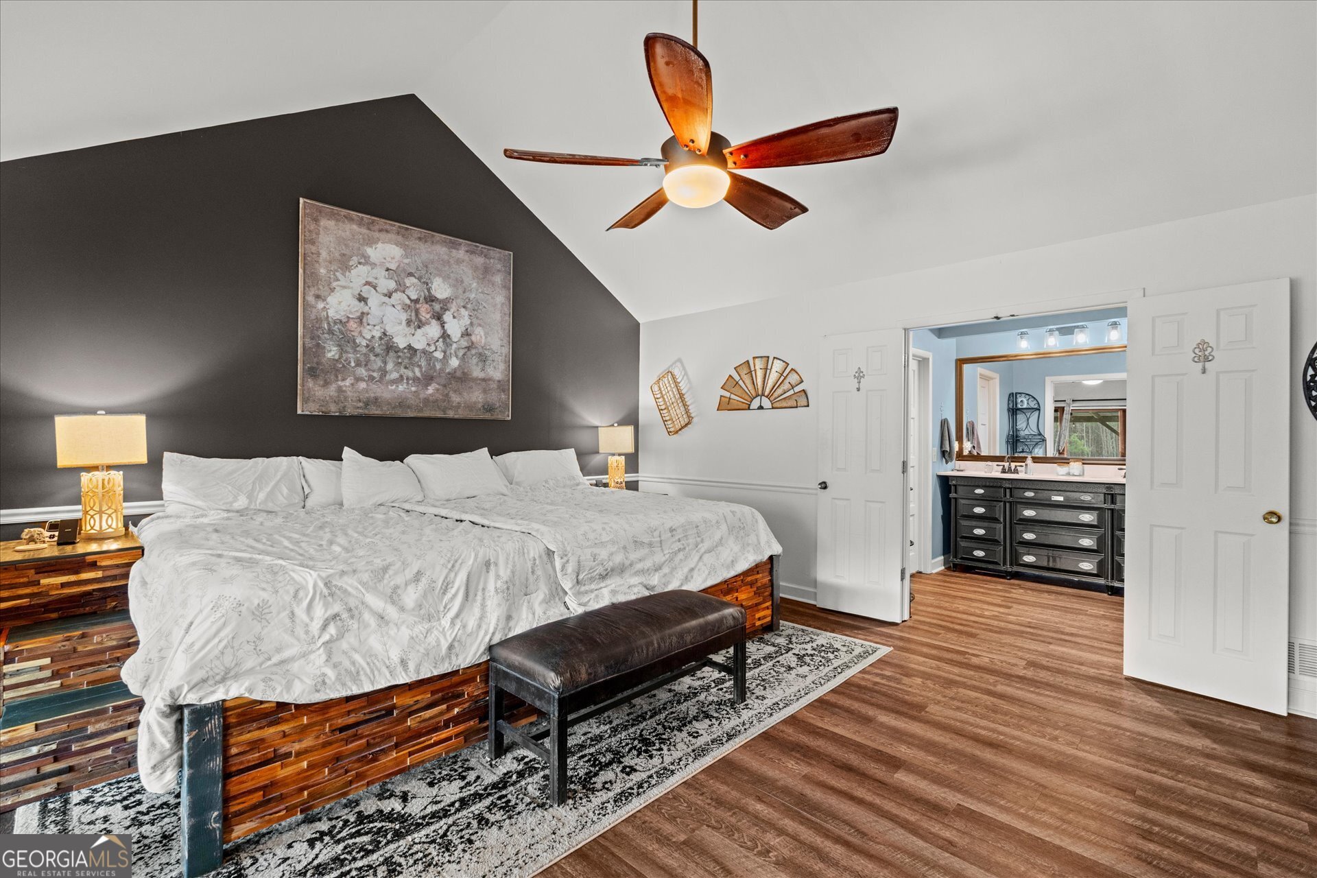 620 Smyrna Church Road Carrollton, GA 30117 - Photo 23 of 68 a spacious bedroom with a bed a dresser and wooden floor