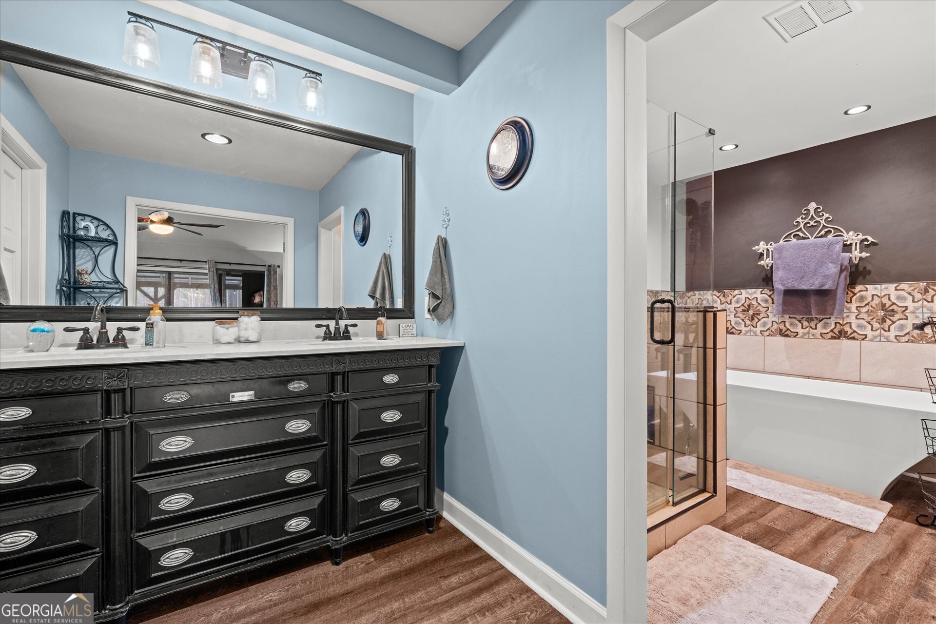 620 Smyrna Church Road Carrollton, GA 30117 - Photo 26 of 68 a bathroom with a sink double vanity and a mirror