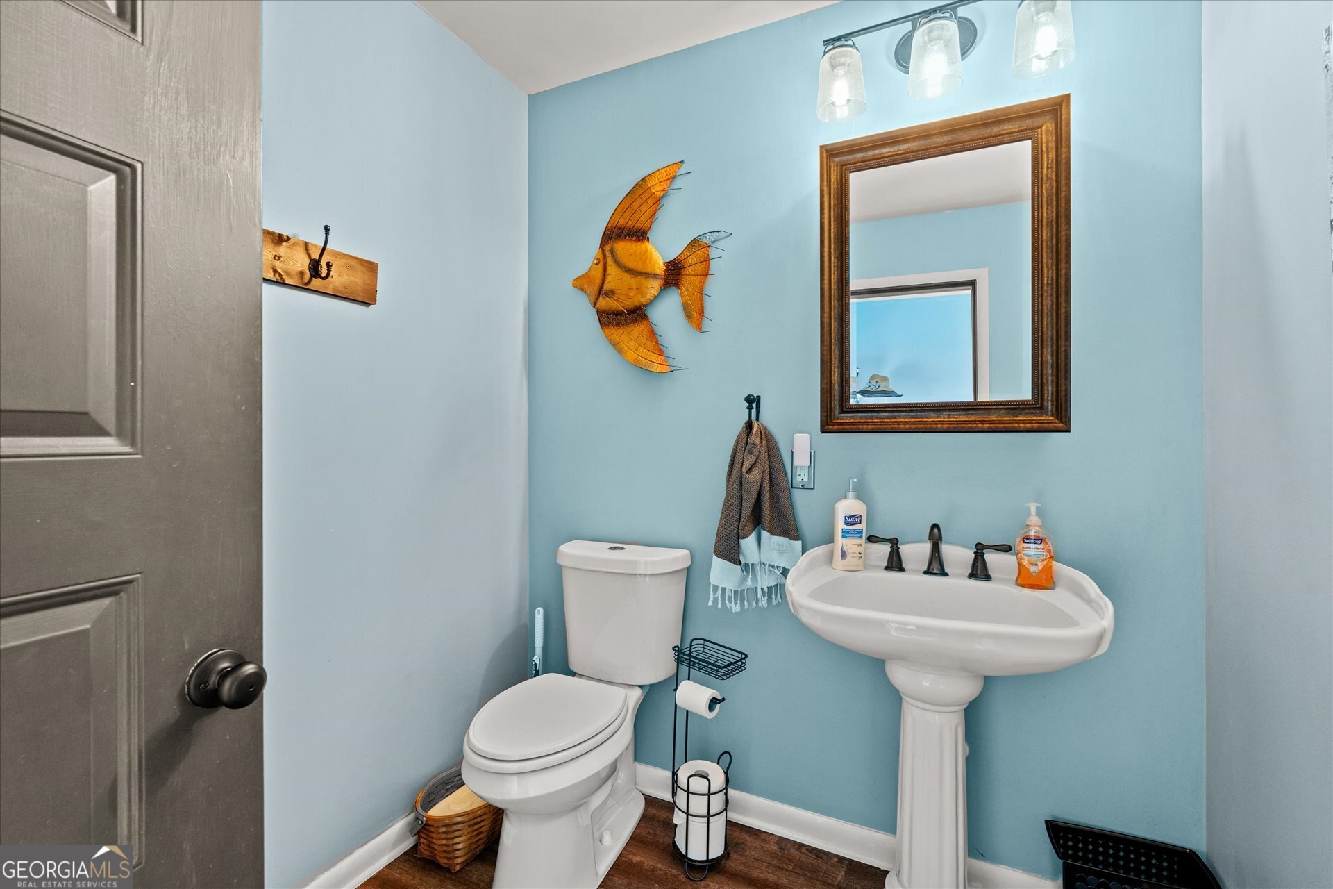 620 Smyrna Church Road Carrollton, GA 30117 - Photo 31 of 68 a bathroom with a sink toilet and a mirror