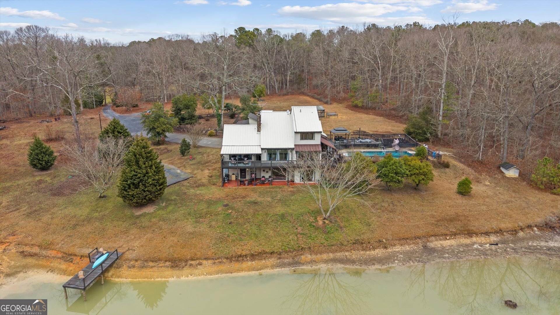 620 Smyrna Church Road Carrollton, GA 30117 - Photo 4 of 68 a view of a lake with a mountain and trees in the background