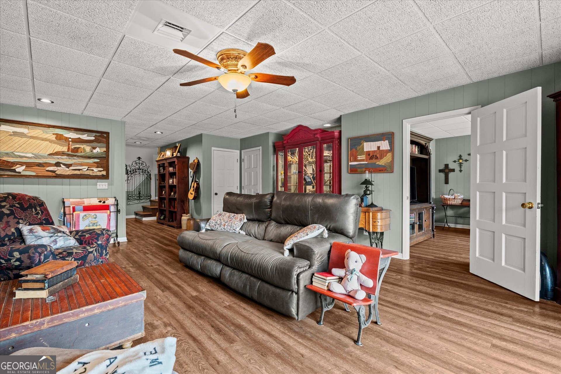 620 Smyrna Church Road Carrollton, GA 30117 - Photo 42 of 68 a living room with furniture ceiling fan and a rug