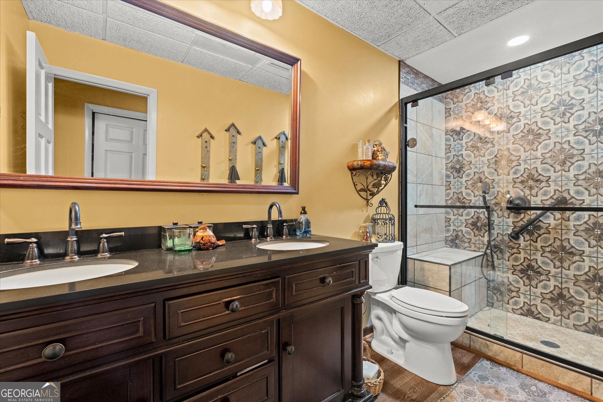620 Smyrna Church Road Carrollton, GA 30117 - Photo 45 of 68 a bathroom with a granite countertop toilet sink and mirror