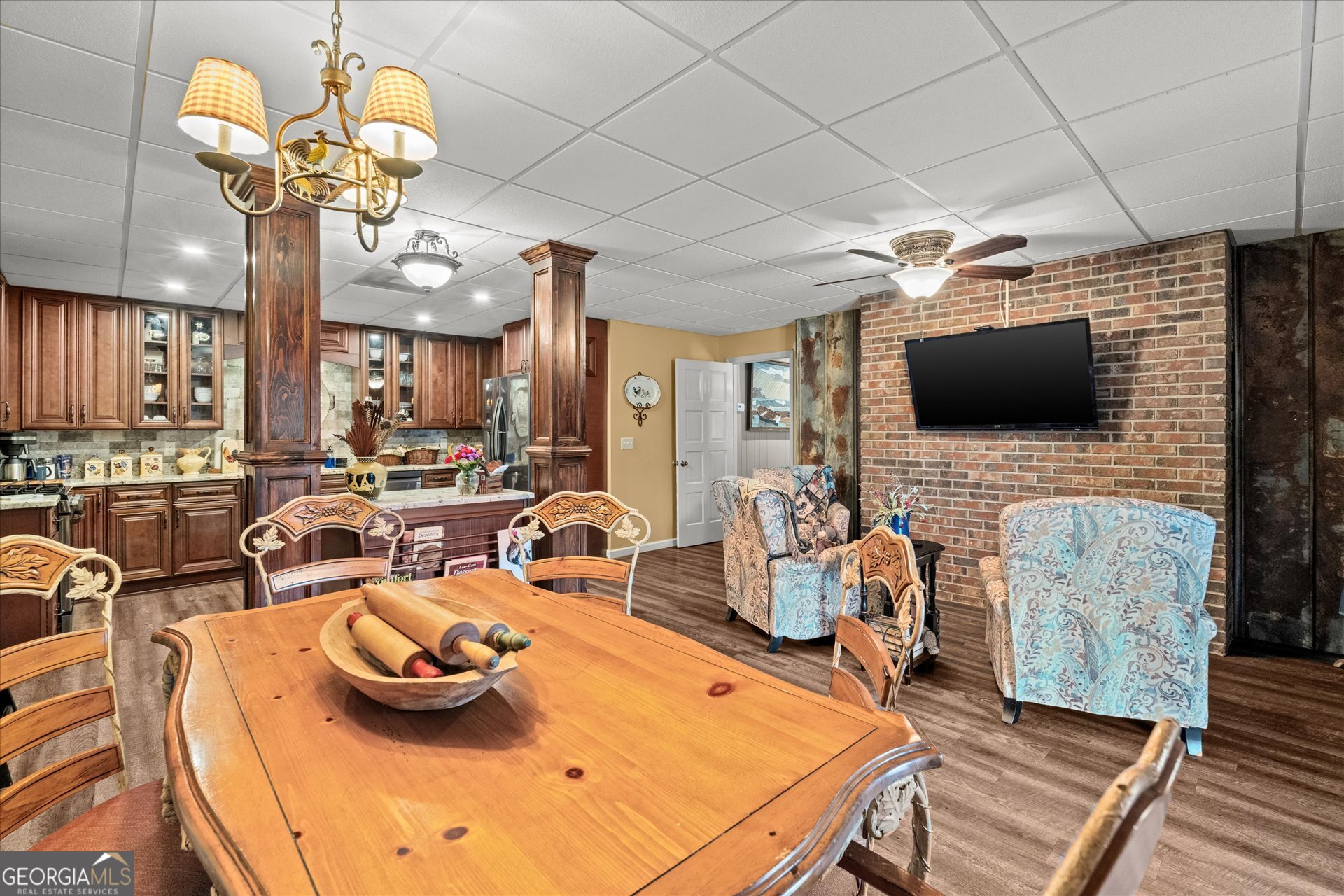 620 Smyrna Church Road Carrollton, GA 30117 - Photo 53 of 68 a room with stainless steel appliances kitchen island granite countertop furniture and a flat screen tv