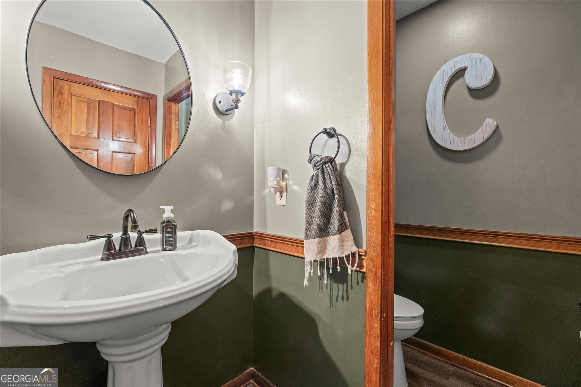 620 Smyrna Church Road Carrollton, GA 30117 - Photo 7 of 68 a bathroom with a sink and a mirror