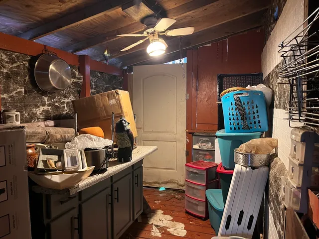 a living room with furniture and a mirror