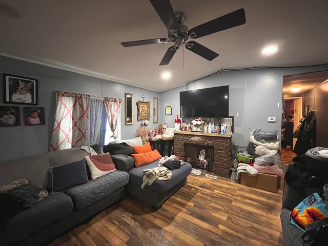 a living room with furniture and a flat screen tv