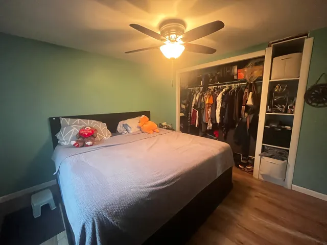 a bed sitting in a bedroom next to a window